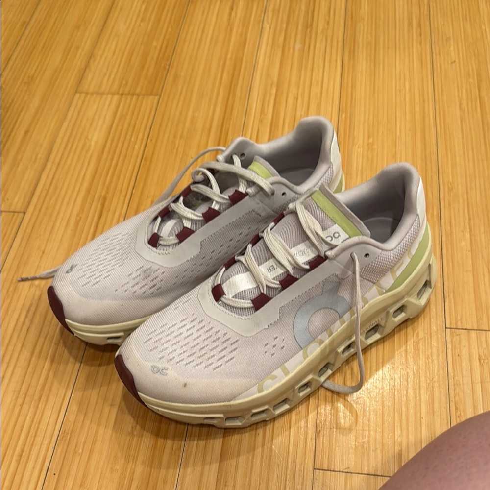 On Running Cloudmonster Cream, Light Green, and Maroon Shoes